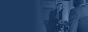 Woman shaking hands with client in office